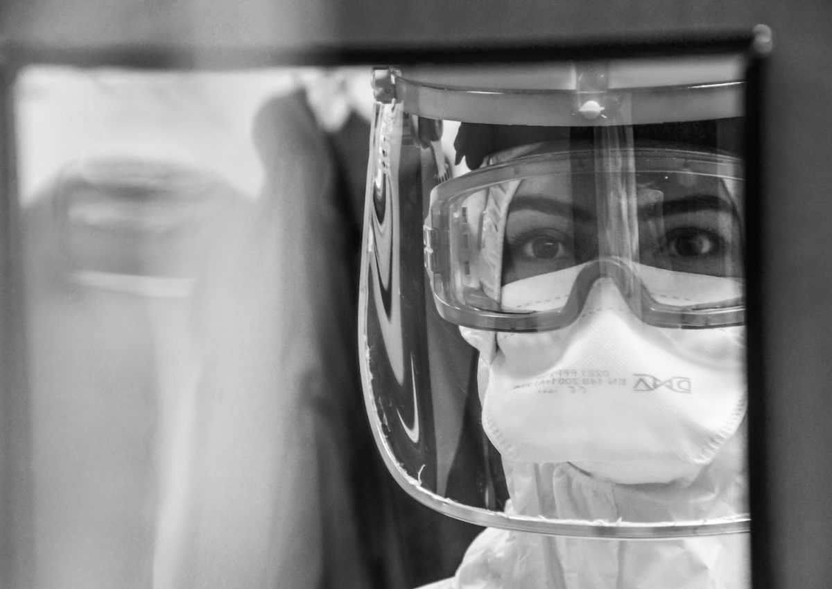 grayscale photo of man wearing goggles