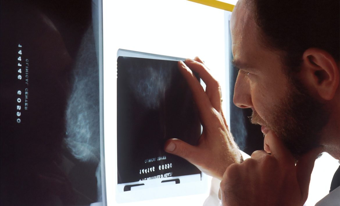 person holding black tablet computer