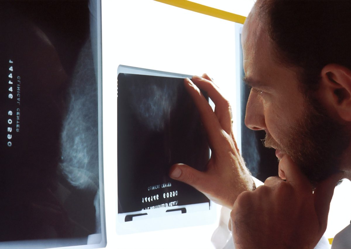 person holding black tablet computer